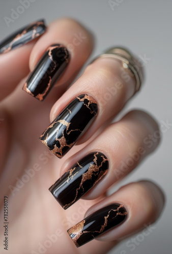 Black nails with copper metallic art, ideal for fashion and beauty themes. luxury and modern trends