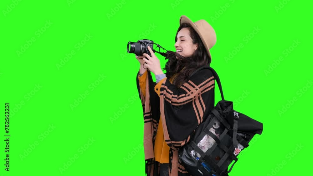 Smiling woman ready to take photo by camera during trip on the chroma key Smiling woman ready to take photo by camera during trip on the chroma key