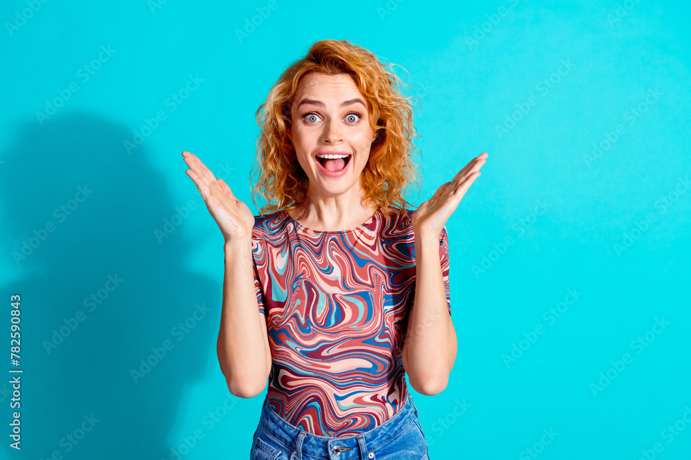 Portrait of nice lady raise arms empty space wear t-shirt isolated on teal color background Portrait of nice lady raise arms empty space wear t-shirt isolated on teal color background