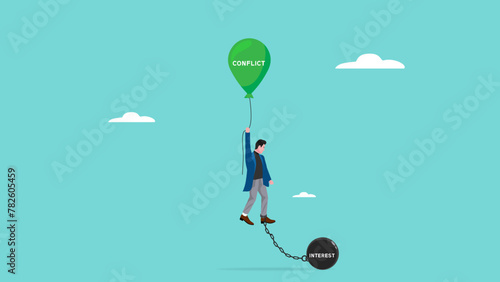 Conflict or interest decision, conflict management concept, confused businessman who is bound by a balloon of interests and weight ball of conflict photo