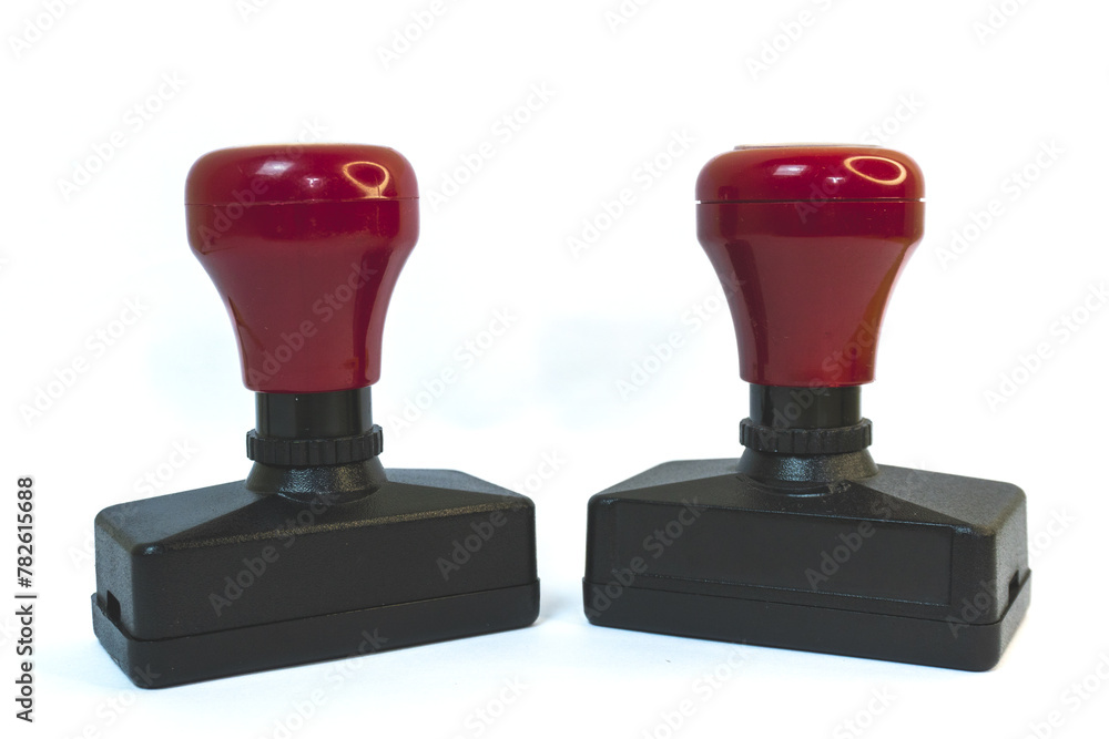 Two red and black stamps isolated on a white background. Two red and black stamps isolated on a white background.