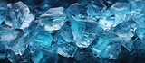 Ice cubes on blue background. Abstract ice texture. Close up.
