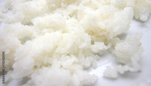 white rice prepared for lunch. meal details. Blocks of white rice stuck together.