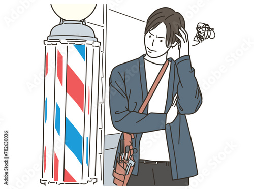理容室のサインポールの前で悩む男性理容師