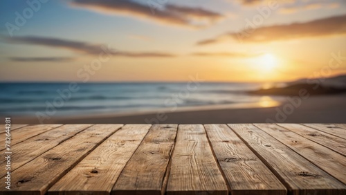 Empty wooden table top with lights bokeh on blur beach and sunset background
