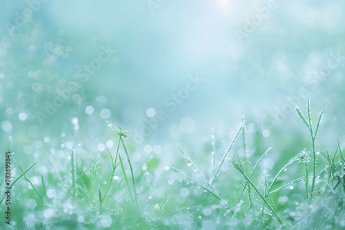 Beautiful spring background with dew on fresh green grass
