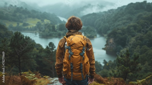 An adventurous man trekking explorer in the remote wilderness. Enjoy mountain life In hiking with a backpack back view