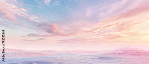 A beautiful sky with a pinkish hue and a few clouds. The sky is filled with a sense of calmness and serenity © tracy