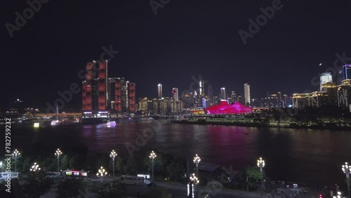 Chongqing China - October 20. 2023: Night scene in the Chinese metropolitan city Chongqing with linuminated modern buildings photo