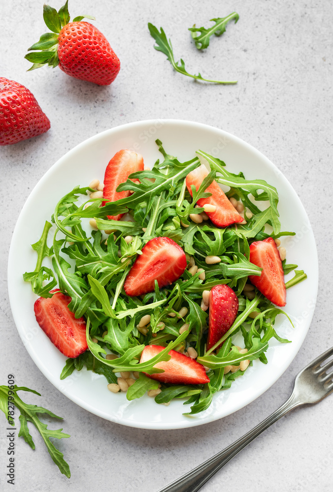 Fresh Strawberry Arugula Salad With Pine Nuts Served on a Bright Day Fresh Strawberry Arugula Salad With Pine Nuts Served on a Bright Day