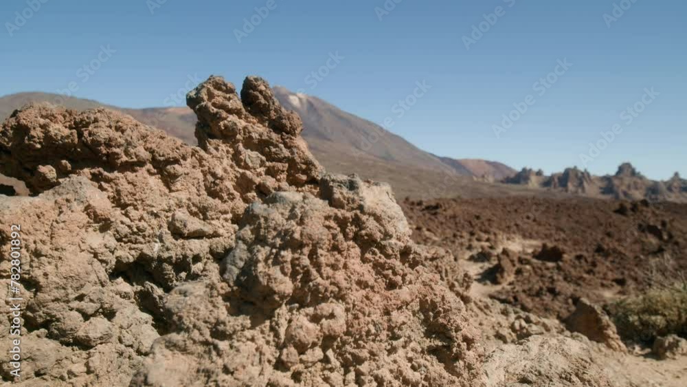 Mount Pico del Teide and Los Roques de Garcia revealed behind volcanic rock, Teide National Park in Tenerife, Canary Islands in spring Mount Pico del Teide and Los Roques de Garcia revealed behind volcanic rock, Teide National Park in Tenerife, Canary Islands in spring