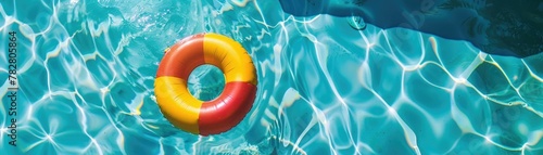 Colorful swimming rings floating in a blue swimming pool, summer background, swimming pool in summer, summer holidays