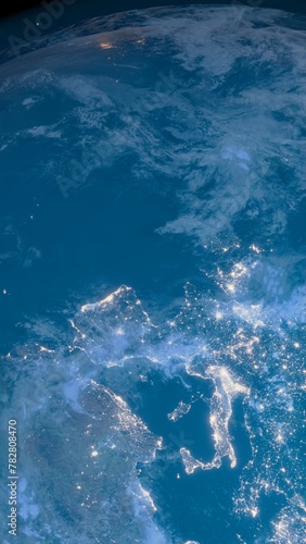 Vertical social media ready Earth cgi render close up with city lights from Italy to China, illustrating global urbanization.