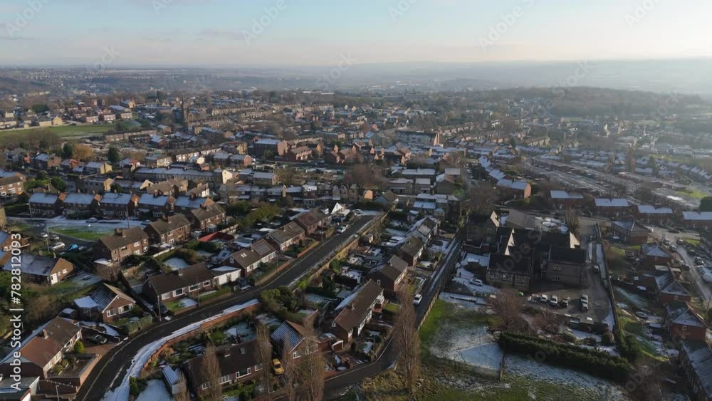 Drone's-eye winter view captures Dewsbury Moore Council estate's typical UK urban council-owned housing development with red-brick terraced homes and the industrial Yorkshire. Working class housing Drone's-eye winter view captures Dewsbury Moore Council estate's typical UK urban council-owned housing development with red-brick terraced homes and the industrial Yorkshire. Working class housing