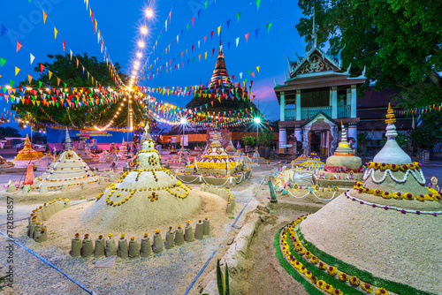 PHITSANULOK, THAILAND - April 11,2024:Thai people come to build the sand Pagoda for return the sand to the temple on Songkran festival Thai tradition at Ratchaburana temple in Phitsanulok,Thailand. © Thinapob