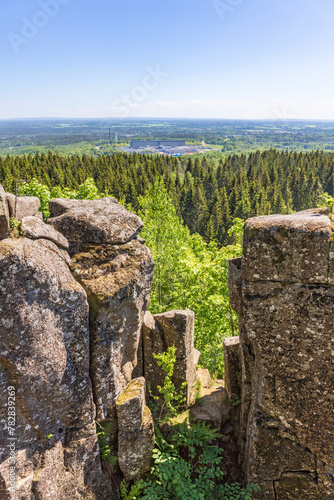 Stone pillar and a scenic landscape view photo