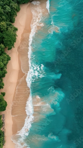 An aerial perspective of a sandy beach stretching out into the ocean