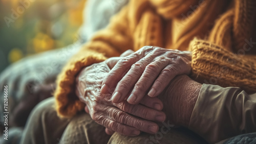 Close-up of elderly hands resting together. Concept of aging, care, and compassion. Design for healthcare, senior support services, and poster.