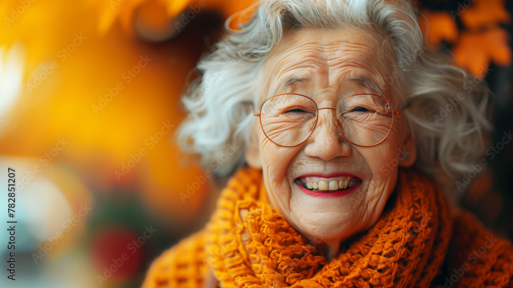 A asian woman with glasses, a yellow scarf is smiling. She looks happy and content. Concept of warmth and happiness. a fat old woman with 102 years old and a funny face and she is laughing in a photo A asian woman with glasses, a yellow scarf is smiling. She looks happy and content. Concept of warmth and happiness. a fat old woman with 102 years old and a funny face and she is laughing in a photo