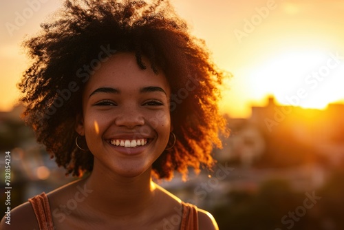 A beautiful woman with curly hair smiling brightly during a sunset Fictional Character Created by Generative AI.