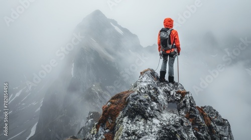 A determined adventurer climbs a mountain photo