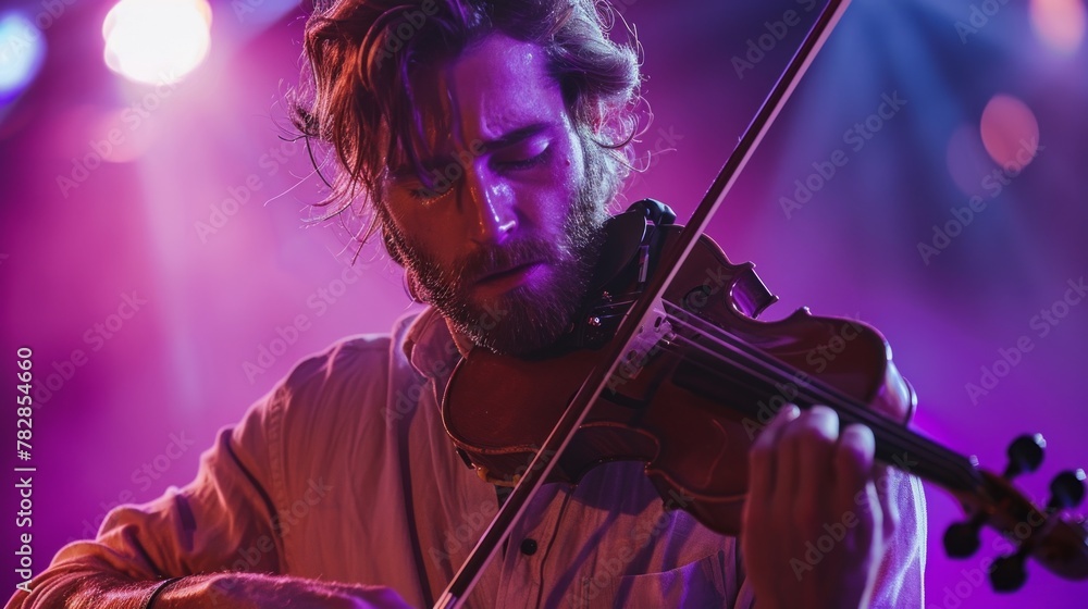 Fototapeta premium A passionate musician plays the violin with emotion