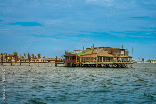 Old docks hosting bars and restaurants in the waterfront of Walvis Bay, Namibia © Luis