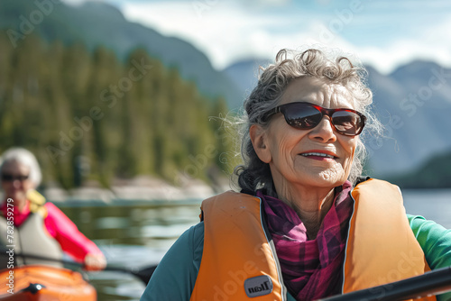 A mature woman enjoys the experience of rafting © Jelena