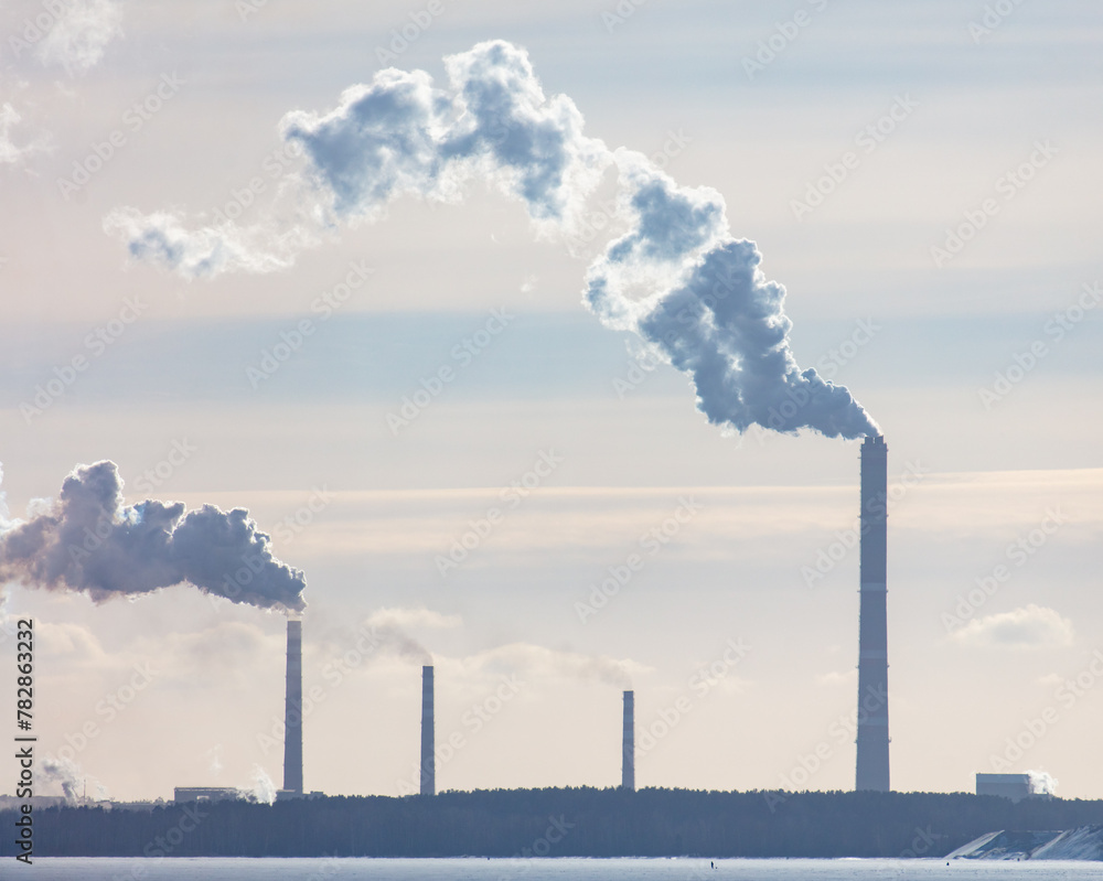 Smoke from the chimneys of a metallurgical plant in winter Smoke from the chimneys of a metallurgical plant in winter