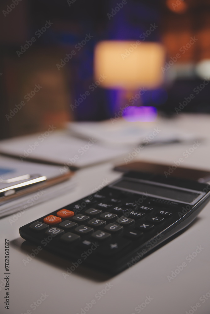 Business woman using calculator for do math finance on wooden desk in office and business working background, tax, accounting, statistics and analytic research concept Business woman using calculator for do math finance on wooden desk in office and business working background, tax, accounting, statistics and analytic research concept