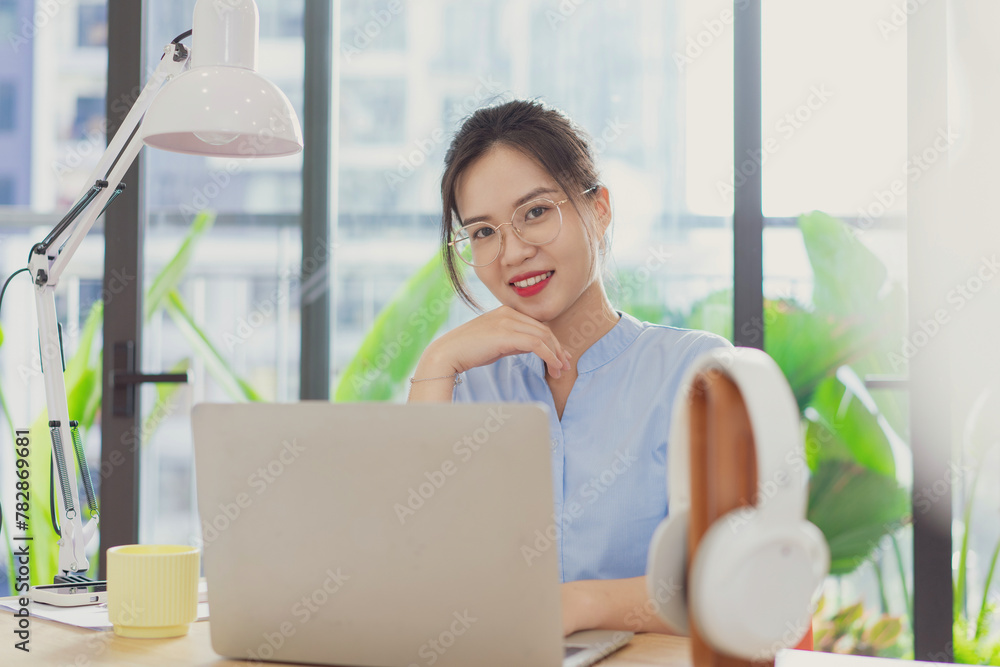 Photo of young Asian businesswoman working Photo of young Asian businesswoman working