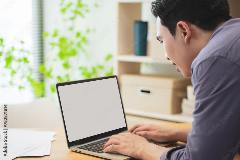 Photo of young Asian businessman working Photo of young Asian businessman working