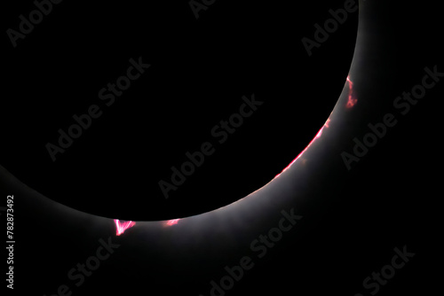 Late in totality prominences, filaments, and flares are seen in the chromosphere of the sun as the moon blocked the the star during the April, 2024 total solar eclipse.