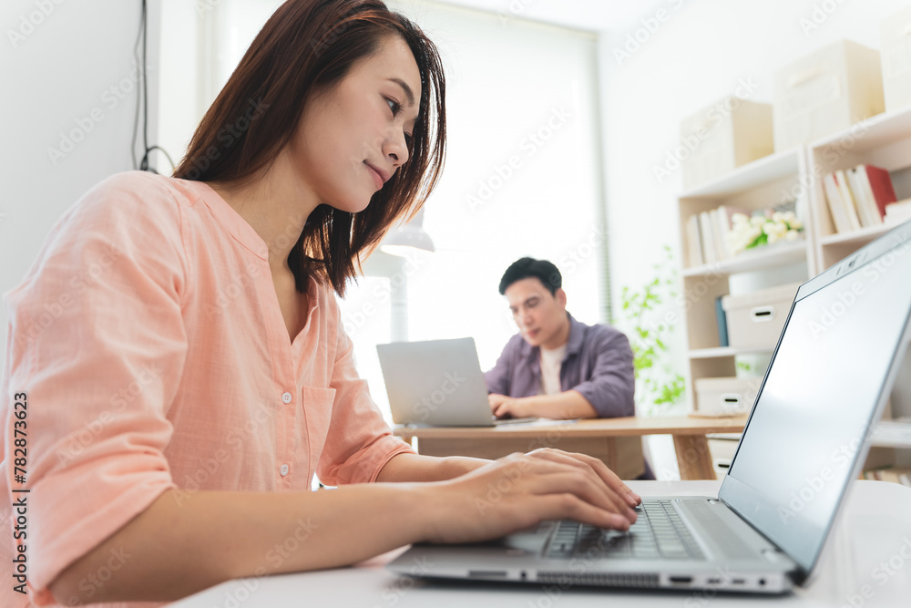 Two Asian businesspeople at office Two Asian businesspeople at office