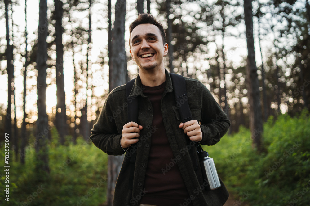 One caucasian male hiking in the woods One caucasian male hiking in the woods