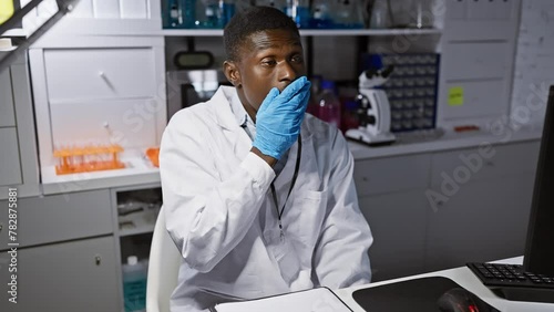 Wallpaper Mural Shocked african american man scientist in gloves covers mouth by hand in lab, surprised and afraid after error, showing silent fear expression. Torontodigital.ca