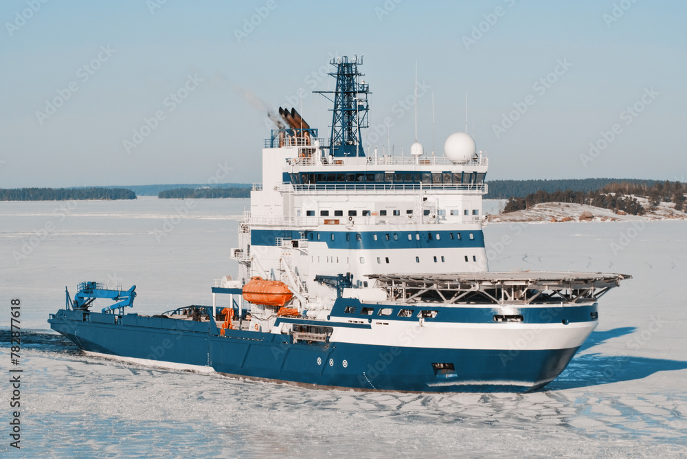 Icebreaker Vessel On Duty For Icebreaking Services For Safe Navigation. Operations In Arctic Areas. Ship With Helicopter Deck.