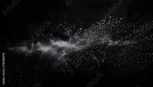 Freeze motion of white dust particles splash on black background.White powder explosion clouds.