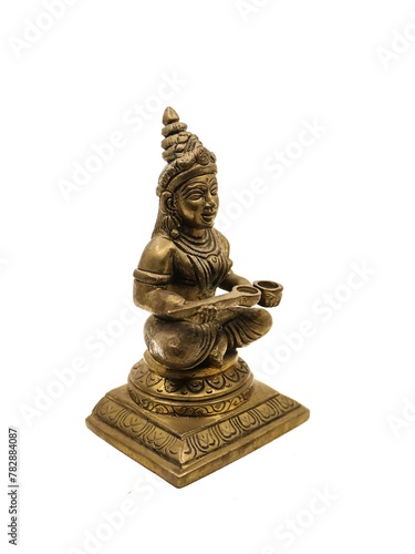 hindu goddess of food and nourishment, annapurna devi antique sitting handcrafted brass statue isolated in a white background