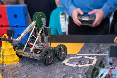 Robotics competitions, children control robots