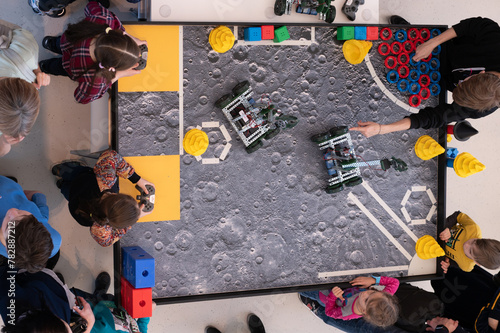 Robotics competitions, children control robots