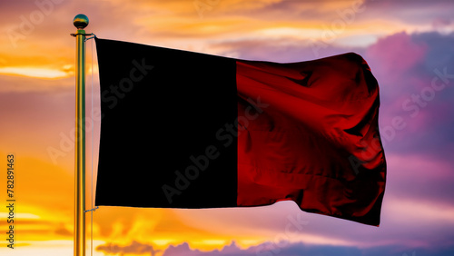 Valle D Aosta Waving Flag Against a Cloudy Sky at Sunset.