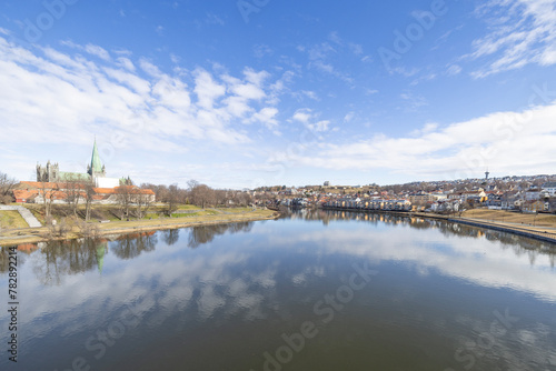 walking along nidelven  river  in a spring mood in trondheim city  tr  ndelag  nidelven  water  river  landscape  sky  nature  city  reflection  view  trees  clouds  travel  architecture  house  buildi