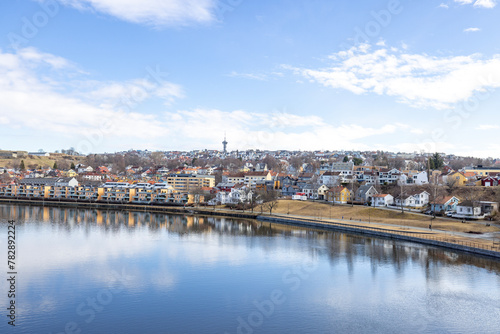 walking along nidelven (river) in a spring mood in trondheim city, trøndelag, nidelven, water, river, landscape, sky, nature, city, reflection, view, trees, clouds, travel, architecture, house, buildi photo