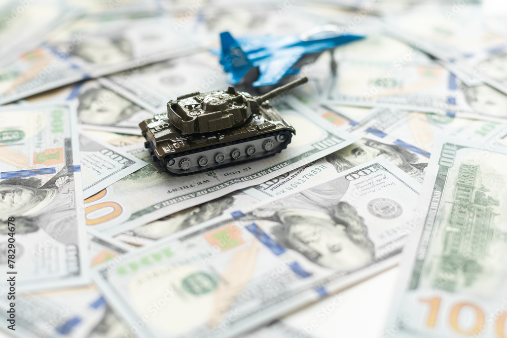 tank against the background of dollars. Concept of war. tank against the background of dollars. Concept of war.