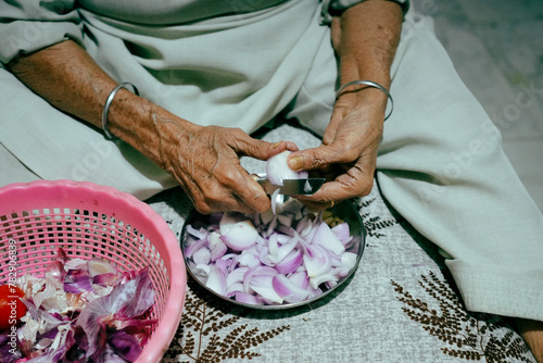 Indian women cutting pyaaz photo