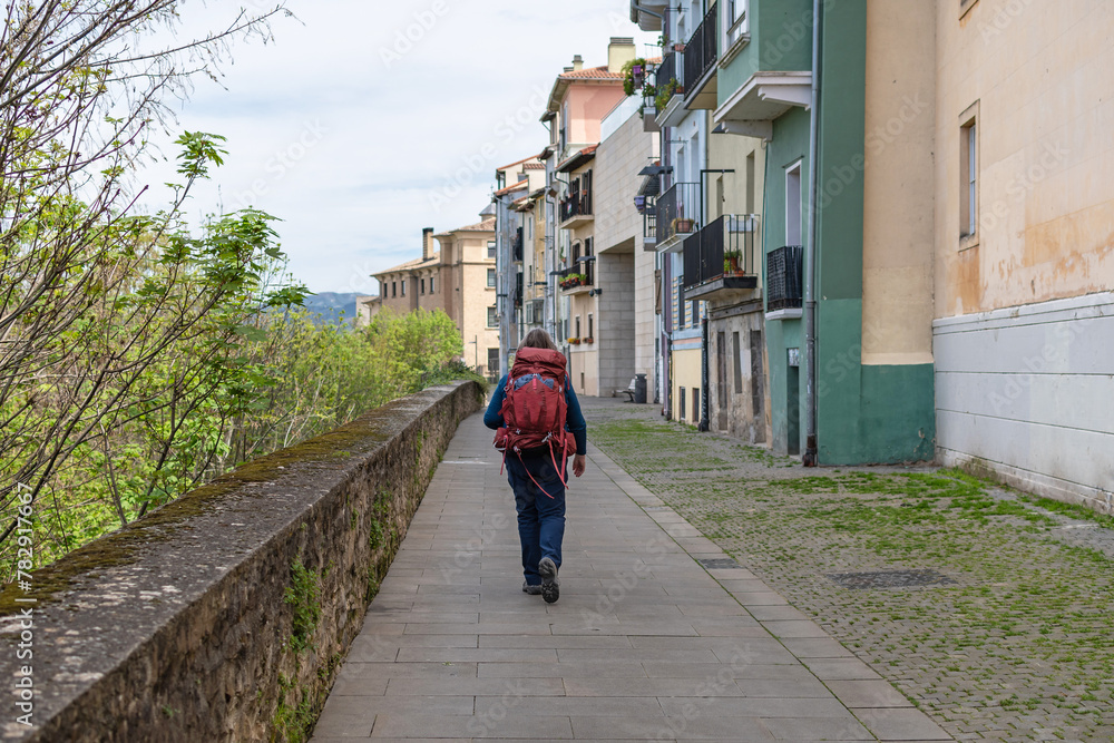 Pilgrim walking along the walls of Pamplona. Way of St. James