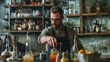 barman making cocktail with citrus garnish, orange wedges, glasses and