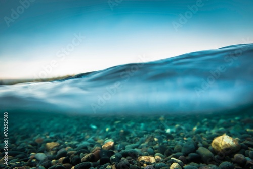 Closeup of rocks under blue water