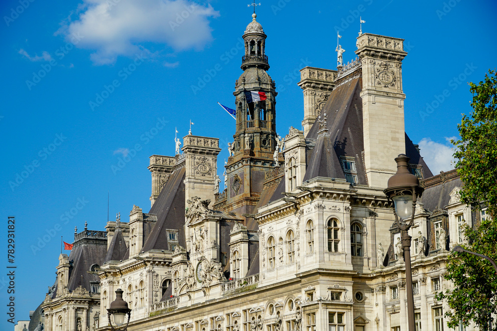 Beautiful shot of Hotel de Ville against a cloudy blue sky in Paris, France